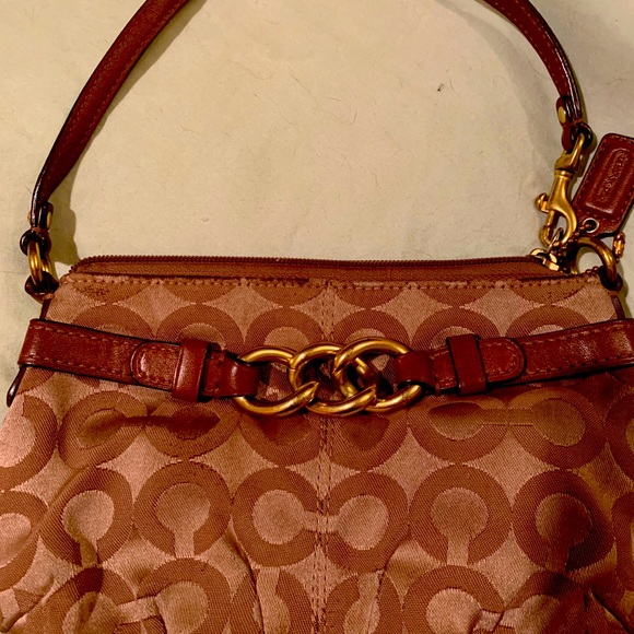 Mini Coach unique small clutch/purse with handle gently used. Must have!